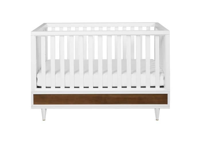 white and walnut crib